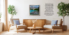 a cozy living room with a wooden coffee table, two beige armchairs, and a framed landscape painting hanging on the wall.