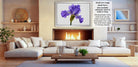 a cozy living room with a fireplace, white sofas, and a wooden coffee table. The room has a warm and inviting atmosphere, with a fireplace providing a focal point and a painting of a purple iris hanging above it. The furniture and decor create a harmonious and comfortable space for relaxation and socializing.