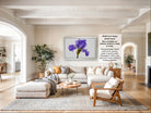 The image is a large, bright, and spacious living room with a comfortable sofa, a coffee table, and various decorative elements such as potted plants and vases.